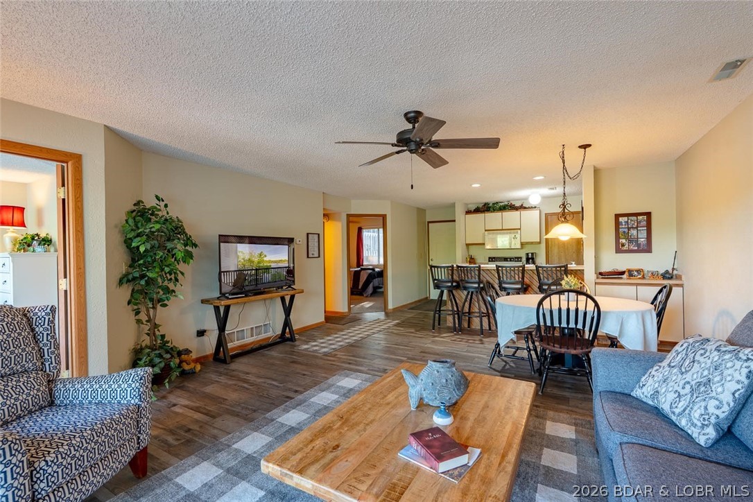 Looking for a peaceful place at the lake to truly call your own? This 2 bed, 2 bath condo at 98 Jonathan Dr. checks all the boxes. Remodeled in 2021 with all new flooring, paint, and showers.  Located down Horseshoe Bend, just minutes from the dam, shopping, and popular lakefront restaurants, you get the best of convenience and escape. Tucked into a smaller, well-kept complex, you’ll love the quiet, cozy atmosphere. With no short-term rentals allowed, this is the perfect spot to unwind, avoid the crowds, and enjoy lake life at your own pace—whether for weekend getaways or full-time living. Enjoy access to a community pool and your own dock slip, making it easy to get out on the water whenever you like.