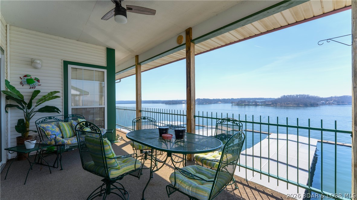 Condo life, is ALL about the view and the panoramic views at this condo, are breathtaking! That's what sets this complex apart from others. Opportunities like this are rare, with few units that offer such an expansive vantage point. This top-floor, lakefront 3 bed / 2 bath end-unit condo, features vaulted ceilings and the added benefit of no neighbors above, creating a quiet & spacious retreat. This unit comes turn-key and tastefully furnished, ready for immediate enjoyment as your personal getaway or investment property. Boating lovers will appreciate the large 14x36 slip that's included as well! Additional conveniences include an exterior storage closet and an assigned parking space located right next to the building. Community amenities include two pools, a tennis/pickleball court, exercise/workout room, lakeside boardwalk and a playground—providing something for everyone! Friendly neighbors, incredible location being right next to the Bagnell Dam Strip, front row seats to the Lake Race and the new 5 level entertainment complex next to the Dam! This is your opportunity to enjoy the lake lifestyle to the fullest!