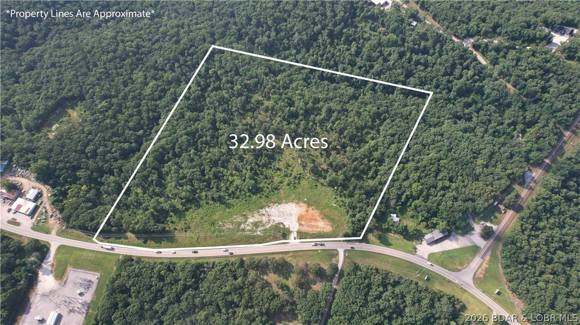 Development opportunities with this combination of acreage, highway frontage, & flexibility are becoming increasingly difficult to find. This 34-acre tract offers approximately 950 feet of Highway 7 frontage just outside Greenview, MO, w/ electric already at the property & a cleared building site ready to jumpstart your project. Whether you're planning a residential subdivision, estate lots, multifamily development, retail center, office space, storage units, or another commercial venture, this property offers the visibility, accessibility, & room to bring your vision to life. Located just minutes from Camdenton & the Lake of the Ozarks, you'll benefit from a growing market, convenient access, and outstanding long-term investment potential. The owner is willing to subdivide, creating flexible opportunities for developers, builders, investors, or business owners looking for the right amount of acreage. If you've been searching for development land with Highway 7 frontage, electric at the property, and the flexibility to accommodate both residential & commercial growth, this is one you'll want to see before it's gone. Large tracts like this rarely become available in today's market.