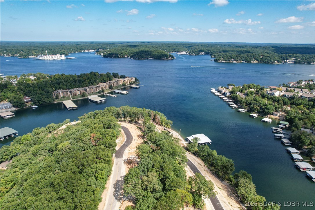 Be one of the first to buy your new lot at one of the Ozarks hottest new subdivisions, The Waters. The Waters is located at Horseshoe bend on the 3 MM of the lake. There are 27 different lot locations and each have their own unique layout and characteristics. Fantastic views of the 3 MM looking out onto the deep water cove. There are several great water hangouts like Boathouse, Tap & Grill, and Shady Gators only minutes away. Two amazing Four Seasons golf courses within 5 minutes, along with countless lake activities to enjoy. Supply is limited so do not hesitate. Take your once in a lifetime opportunity to build your dream home at The Waters today!