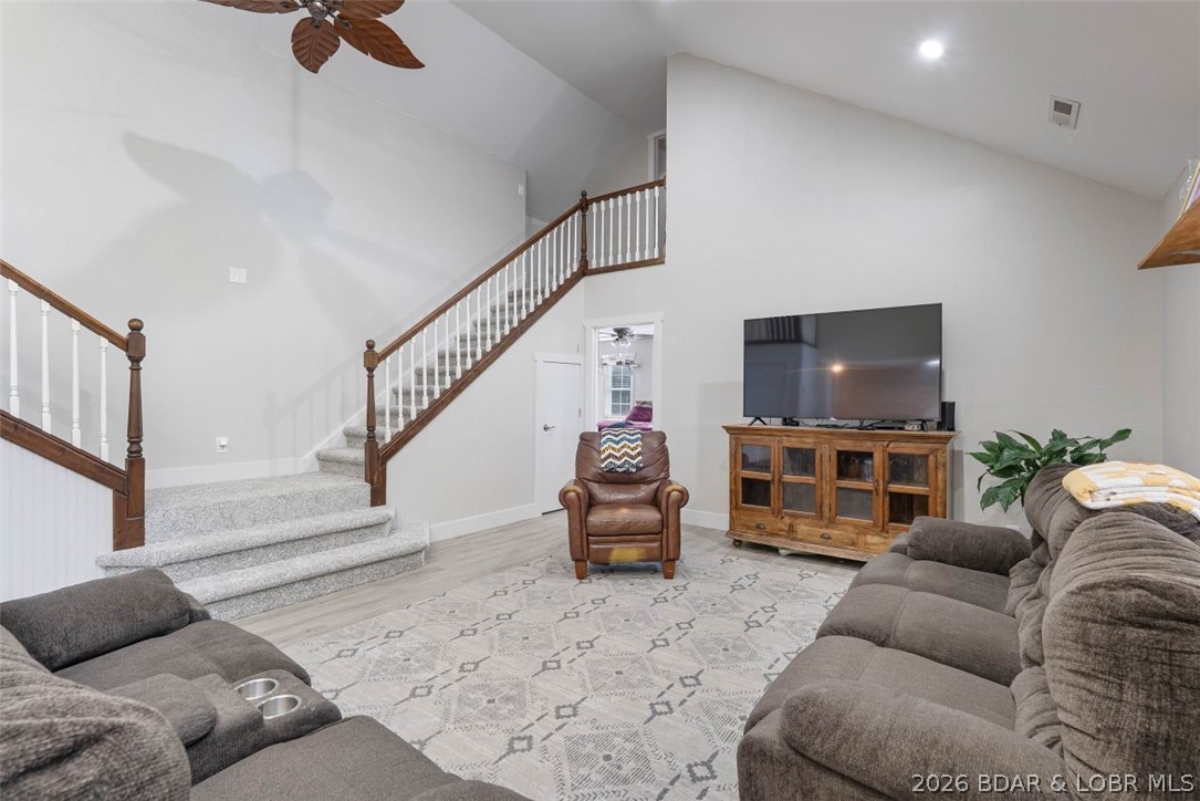 Don't miss this exceptional 4-bedroom, 3-bath home offering the perfect combination of space, comfort, and functionality. The heart of the home is a spacious open great room featuring stunning staircases leading to the upper level, creating an impressive gathering space. Enjoy the convenience of true main-level living in this thoughtfully designed home. Connected directly to the primary suite is a versatile bonus room that can easily adapt to your lifestyle. Use it as a home office, nursery, playroom, fitness space, reading retreat, or cozy sitting area—possibilities are endless. Recent updates include new flooring, fresh interior paint, and new refrigerator and stove, making this home move-in ready. Outside, you'll find a large attached 2-car garage along with an impressive 2,500-square-foot metal building—ideal for a workshop, storing equipment, hobbies, or additional vehicles. Situated on three lots, the property offers abundant outdoor space with endless possibilities for recreation, gardening, or future expansion.  This unique property delivers the space you need, the updates you'll appreciate, and the versatility you've been looking for. Schedule your private showing today!