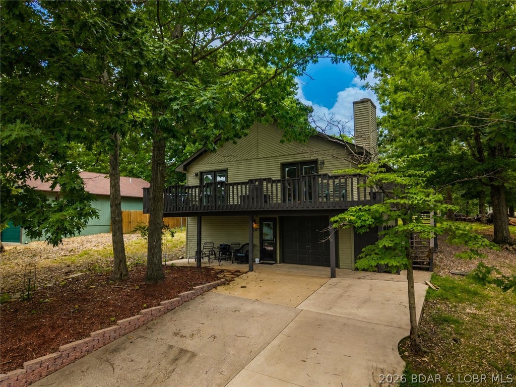 Welcome to lake living at its finest in the desirable Fawn Valley Subdivision! This 4+ bedroom, 3 full bathroom home is situated on a gentle second-tier lot with seasonal lake views and offers the ideal blend of comfort, quality, and recreation.
Step inside and appreciate the beautiful finishes including stunning travertine tile, premium carpet with upgraded padding, and gorgeous solid hardwood flooring throughout the main-level kitchen, dining, and living areas. The heart of the home features granite countertops, a new sink and fixtures.  Cozy up on cool evenings beside the impressive new stone wood-burning fireplace.
Outside, you'll discover why Fawn Valley is one of the Lake area's most desirable communities. Residents enjoy a relaxed, golf-cart-friendly lifestyle with outstanding amenities, including a community swimming pool,  community dock  with your boat slip, boat ramp, and outdoor pavilion. Whether you're spending the day on the water, cruising on your golf cart, or simply unwinding poolside, this community offers something for everyone.
If you're searching for a full-time residence or a lake getaway,  Fawn Valley is truly hard to beat!