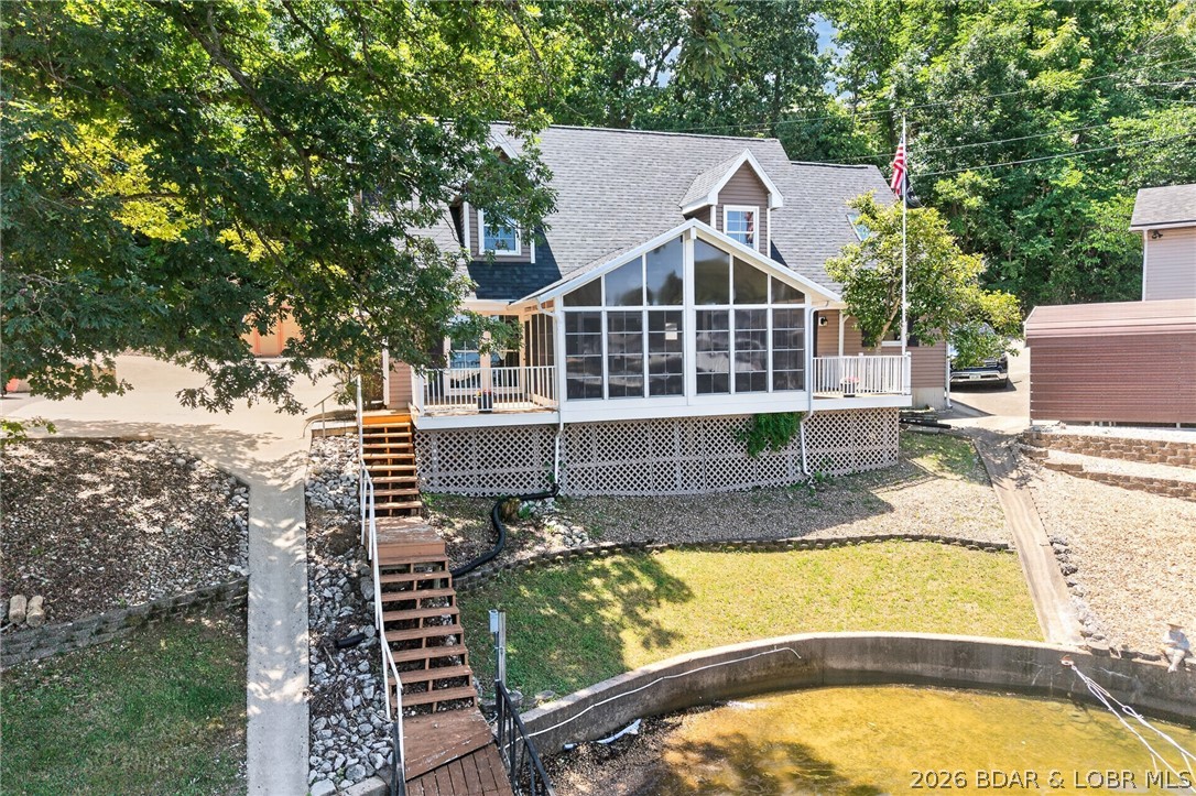 Lakefront living is easy in this 4 bedroom, 2.5 bath home featuring beautiful views, a near flat lot, and minimal steps to the water, an increasingly rare combination at Lake of the Ozarks. With 2,280 square feet of finished living space, there is plenty of room for family and guests to enjoy the lake lifestyle. The updated upper level, large three season porch, and adjoining deck provide the perfect place to relax and take in the peaceful cove views.
Located at the 4 Mile Marker of the Osage, this property offers paved roads all the way to the home for convenient year round access. Enjoy an easy walk to your private 10x24 covered dock slip for a day on the water, then return to the comfort of your lakefront retreat. Additional features include an attached one car garage, a new roof completed in late 2025, a pre inspection with septic system reported to be working as intended, and a one year buyer warranty. Ideal as a full time residence, weekend getaway, or investment property.