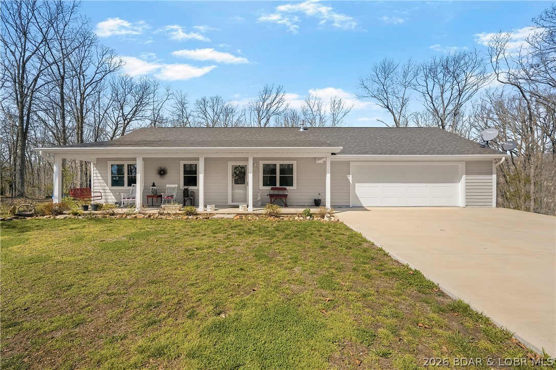 Move-in ready home in Autumn Estates, right off Highway UU near Harry S. Truman State Park, built in 2022!
This beautifully maintained 3-bedroom, 2-bath home, built in 2022, sits on 1.3 peaceful acres in Autumn Estates, conveniently located just off Highway UU and less than 2 miles from Harry S. Truman State Park and Truman Lake. Designed for single-level living, the home includes widened doorways and an accessible layout for ease of movement throughout. Featuring LVP flooring throughout, a custom kitchen with granite countertops, and stainless-steel appliances included, this home is truly turn-key.
Enjoy the parklike setting from the covered front porch or covered back deck, along with a fenced backyard and an oversized two-car garage with room for vehicles, storage, and workspace. Additional features include tinted windows throughout, a tankless water heater, water softener, and an efficient heat pump. 
Ideal as a full-time residence, vacation retreat, or investment property near a premier fishing and recreation destination. Conveniently located near boating, hiking, swimming, a public boat ramp, and all the outdoor recreation Truman Lake has to offer.