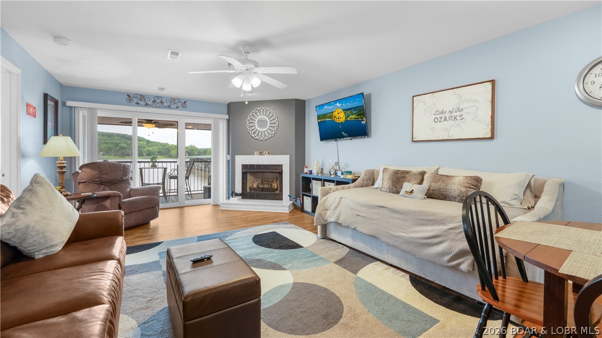 Located just outside of Camdenton in the sought-after Cedar Glen Condominiums on the Big Niangua 13MM. This beautifully maintained lower-level condo delivers an unbeatable lakefront lifestyle with incredible accessibility by both land & water! Cedar Glen is known for its exceptionally well-kept grounds, lower HOA dues compared to many lakefront complexes and outstanding amenities including multiple pools, playground, sand volleyball, boat ramp, trailer parking & more. This unit offers true walk-out access—step off your screened-in deck directly onto the lakefront boardwalk leading straight to the pools and your dock. Enjoy relaxing lake views while also being able to see the included 10x24 boat slip with brand new 7,000 lift, right from the deck! Inside features updated finishes, open-concept living, stainless appliances, composite decking & comes nicely furnished, making it move-in ready for full-time living, weekend getaways or investment use.