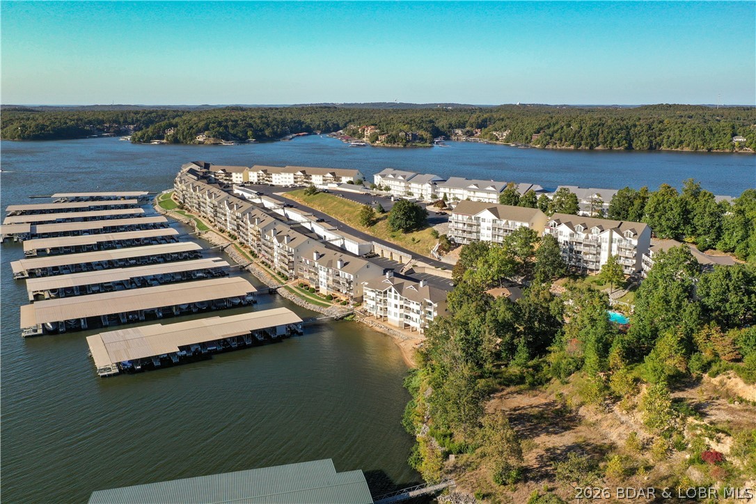 Looking for an Investment property look no further.  Check out this 4 bedroom 3 bath top floor loft unit.  New vinyl plank flooring just installed.  Has great rental history or makes an awesome place for a large family and friends.  Comes fully furnished.  Includes a 10x30 boat slip.  This unit is easily accessible by using the upper parking lot and walking across the bridge to the front door, only a few steps.  Awesome View of the 21MM.  Call for details.
