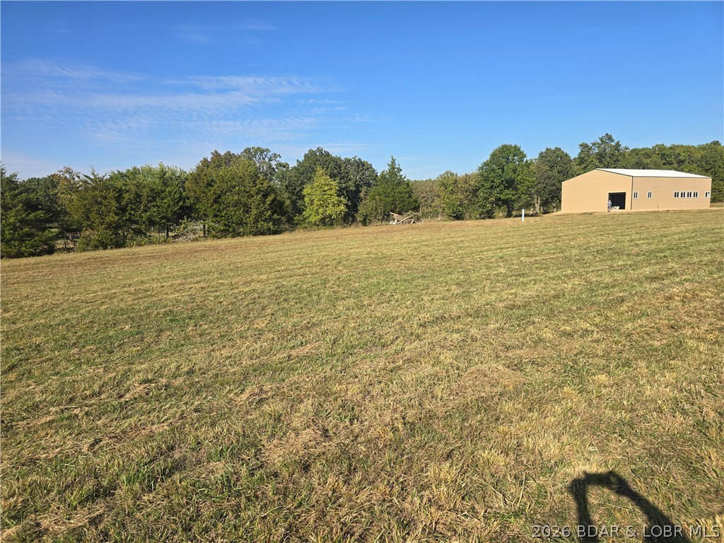 Bring your homesteading, barndominium, or business dreams to life with this ultimate 13.31-acre multi-tract property spanning both sides of the road in Crocker, MO! On one side sits a stunning, nearly new 40x60 metal shop on 5.44 gently rolling acres with 4.73 acres fully fenced for livestock or pets. Built on a concrete slab, the shop features 14-foot eave walls, an 18-foot center peak, robust 200-amp electrical service, and a brand-new well and septic system. Vehicle access is seamless with a 9x8 door and a massive 12x14 door for RVs or heavy equipment. Directly across the road, an additional 7.87 completely wooded, unrestricted acres boast major hunting potential, offering a prime timbered haven for deer and turkey. Use the wooded acreage as your private recreational hunting playground, or carve out a secluded custom homesite hidden in the trees. Live and hunt on your own land, or run your business right across from your private retreat. Schedule your tour today.