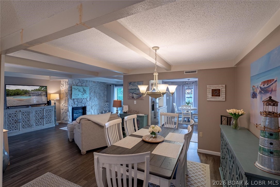 Welcome to Waters Edge Condominiums. Easy living will feel amazing in this gorgeous 3 bedroom, 3 full bathrooms & over 1800 sq ft. unit. Prepare to be wowed! This condo is spacious and updated throughout (including a new HVAC), completely turnkey with designer furniture and accessories...it is MOVE in READY!!  Cozy up next to the fireplace or enjoy 3 covered balconies with lake views and true resort style amenities in one of Lake Ozark's most desirable communities. The complex offers beautiful grounds, clubhouse, community pool, tennis courts, exercise area, playground, boat ramp, & walking trails.