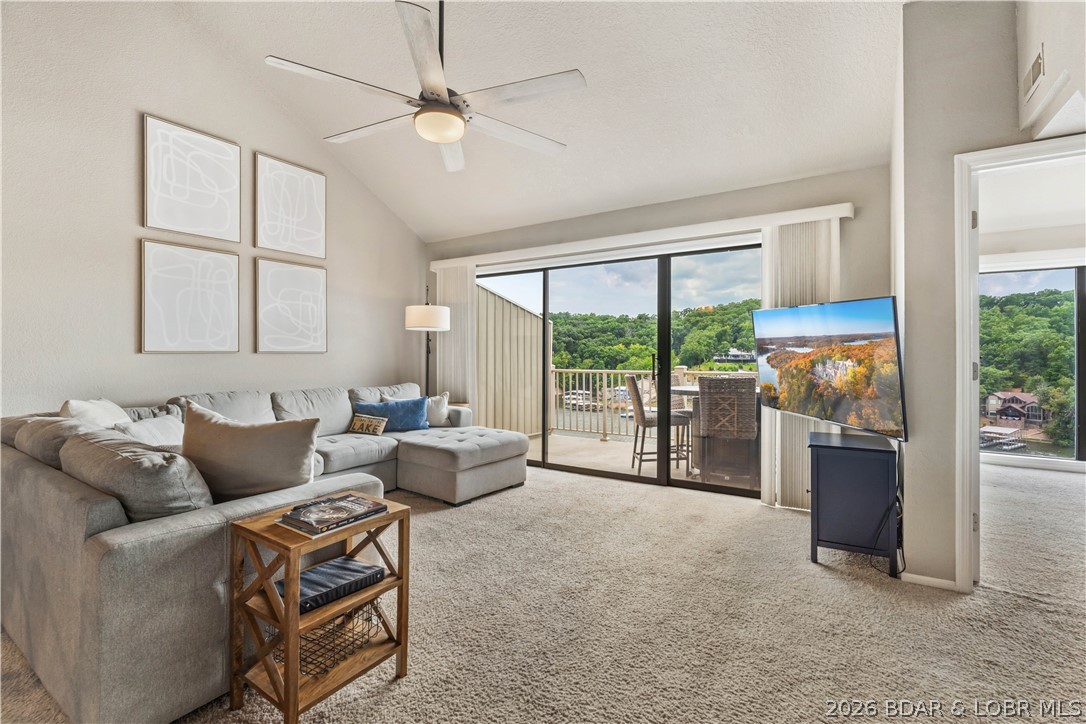 Wake up to panoramic main channel views while enjoying the protection of a peaceful cove in this turn-key, top-floor condo. Offering 3 bedrooms, 2 baths, with the loft serving as the third bedroom, this immaculate unit is ready for immediate enjoyment or rental income with nightly rentals allowed. Relax on the new deck overlooking the pool while taking in the incredible lake views. A 12x32 boat slip and dock box are included, making it easy to spend your days on the water. The resort-style complex offers outstanding amenities including three swimming pools (one heated), a clubhouse, tennis courts, basketball hoops, and a playground. Whether you're looking for a full-time lake retreat, vacation home, or investment property, this condo checks all the boxes with an unbeatable combination of views, amenities, and rental potential.