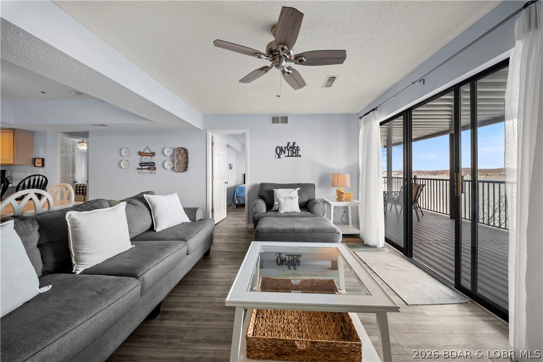 A turnkey Lake Ozark condo offering comfort, convenience, and incredible lake views. This spacious unit features 3 generously sized bedrooms and 3 full bathrooms, providing plenty of room for family, guests, or entertaining. Step outside to the expansive covered back deck and take in the unreal panoramic lake views, perfect for morning coffee or relaxing evenings. Whether you're looking for the ideal weekend lake getaway, investment opportunity, or full-time residence, this property fits the bill. The included boat slip makes lake days effortless, giving you quick and easy access to boating, swimming, and all the fun the Lake of the Ozarks has to offer. Located in The Falls, you’ll also enjoy excellent community amenities including a pool, tennis court, playground, clubhouse, and community dock. Conveniently situated near Lake Ozark attractions, waterfront dining, shopping, and entertainment, you’ll always be close to the action while enjoying a peaceful lakeside setting. Move-in ready and ready for you to start enjoying lake life immediately.