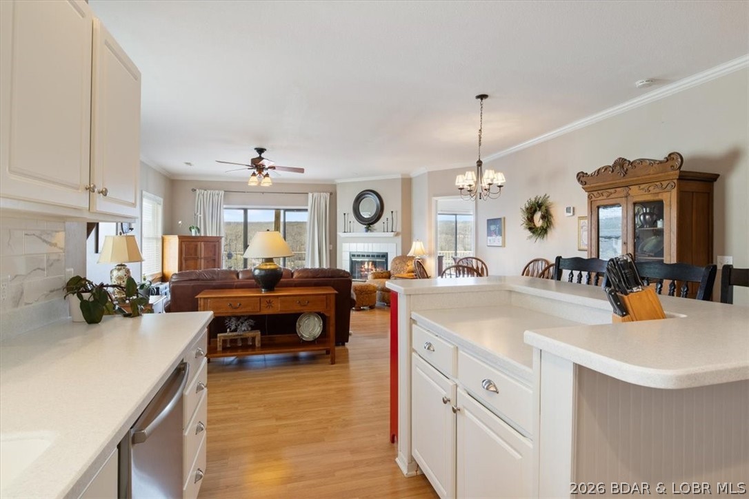 Welcome to easy lake living! This beautifully maintained 3-bedroom, 2-bath condo offers panoramic views of the Big Niangua Arm at the 9MM and includes a 10x24 boat slip with 10,000 lb HydroHoist, and private garage, making it the perfect full-time home or weekend escape. With just 8 steps from parking to your front door, convenience starts the moment you arrive.
Inside, you’ll love the open-concept layout with vinyl plank flooring, hard surface countertops, and stunning lake views. The spacious primary suite features a walk-in closet and private ensuite bath, while two additional bedrooms offer space for guests, an office, or entertaining. A full walk-in laundry room adds everyday convenience.
Step onto your private balcony for peaceful mornings or sunset evenings overlooking the water. Community amenities include a pool, clubhouse, workout center, fishing docks, and direct dock access.
Located near the Ozarks Amphitheater and just minutes to Camdenton, this condo is offered fully furnished with a private garage, additional storage, boat slip and move-in-ready lake living! Start making Lake memories Immediately!