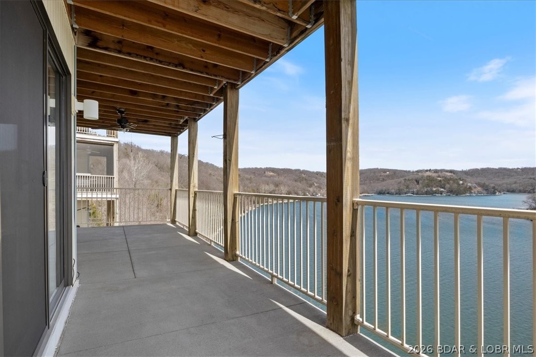 MOTIVATED SELLER! Welcome to easy lake living! This beautifully maintained 3-bedroom, 2-bath condo offers panoramic views of the Big Niangua Arm at the 9MM and includes a 10x24 boat slip with 10,000 lb HydroHoist, and private garage, making it the perfect full-time home or weekend escape. With just 8 steps from parking to your front door, convenience starts the moment you arrive. Inside, you’ll love the open-concept layout with vinyl plank flooring, hard surface countertops, and stunning lake views. The spacious primary suite features a walk-in closet and private ensuite bath, while two additional bedrooms offer space for guests, an office, or entertaining. A full walk-in laundry room adds everyday convenience. Step onto your private balcony for peaceful mornings or sunset evenings overlooking the water. Community amenities include a pool, clubhouse, workout center, fishing docks, and direct dock access. Located near the Ozarks Amphitheater and just minutes to Camdenton, this condo is offered fully furnished with a private garage, additional storage, boat slip and move-in-ready lake living! Start making Lake memories Immediately!