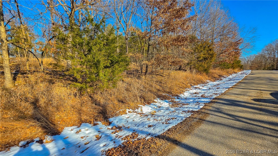 Located in the prestigious Porto Cima community, this 0.52-acre lot offers a rare opportunity to build on exceptionally level terrain. This site stands out as a builder-friendly option, as the flat topography significantly minimizes site preparation costs and provides a versatile foundation for your custom floor plan. Water and sewer agreements are already in place, and because the utilities are located on this side of the road, you can avoid the substantial expenses typically associated with road boring. Development requirements ensure a high-quality environment, calling for a home of at least 1,100 square feet or a residence equivalent in scale to the beautiful homes already gracing the surrounding area. Whether you are looking to develop a primary residence or a sophisticated vacation retreat, this parcel combines a premium location with a truly "build-ready" status, making it one of the most accessible and cost-effective development sites currently available in Porto Cima. As part of the Porto Cima and Four Seasons community, you’ll enjoy an unparalleled lifestyle with access to multiple pools, pickleball and tennis courts, fitness centers, and a private campground.
