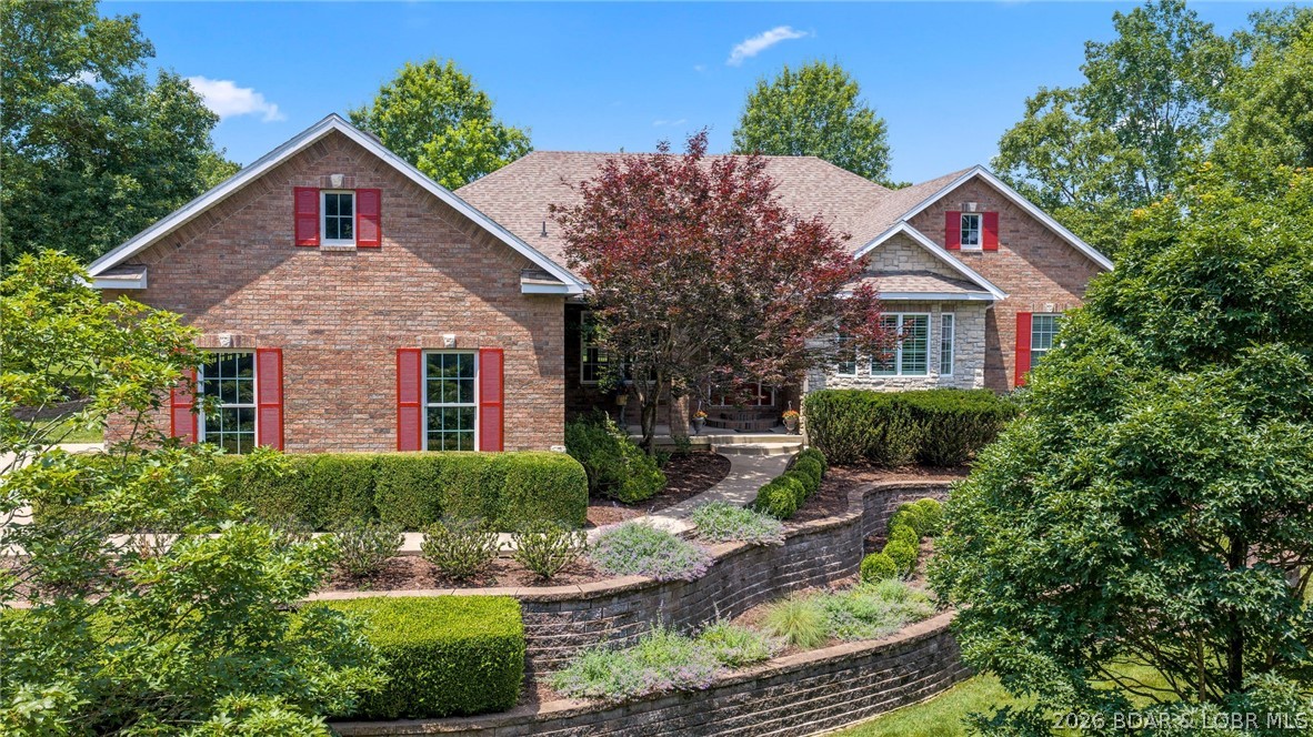 Perfectly situated on the 9th hole of Oak Creek Golf Course in a premier gated community in Osage Beach, this custom-built, all-brick home offers high-quality, low-maintenance living just minutes from shopping, dining, and healthcare. The impressive main level features over 2,700 square feet of open living space, highlighted by a stunning great room with a grand stone fireplace and a wall of windows framing scenic golf course views. Elegant hardwood floors flow into an open kitchen complete with a large walk-in pantry, while an adjoining screened-in porch and grilling patio offer seamless outdoor enjoyment. The primary suite is strategically positioned for the views and boasts a walk-in closet and spa-like bath, sharing the main level with two additional bedrooms, a study, a formal dining room, and an oversized three-car garage. Downstairs, the lower level expands the home with a welcoming family room, two more bedrooms (one non-conforming), a full bath, and a massive unfinished space.   Newly updated in June 2026!  Schedule a showing today today before this gem is gone.