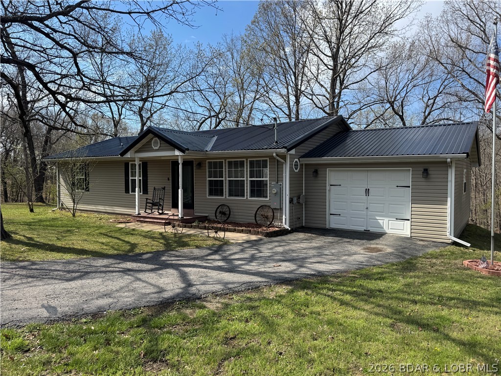 Set on nearly 5 acres, this property offers the rare blend of privacy, space, and convenience. Enjoy your own peaceful retreat with plenty of room to roam, all just minutes from everyday essentials like Dollar General, nearby lake access, and local favorites such as Jolly Rogers Grub N Grog. The well-maintained home features true one-level living with 3 bedrooms and 1.5 baths. Recent updates include a durable new metal roof, doors and water heater. The inviting sunroom provides the perfect spot to relax while overlooking the backyard. Outdoors, the property is ready for your lifestyle with a dedicated garden area and arbor, an above-ground pool, and ample space for pets, chickens, and gatherings with family and friends. Whether you’re looking for a full-time residence or a weekend escape, this property delivers comfort, flexibility, and room to breathe.