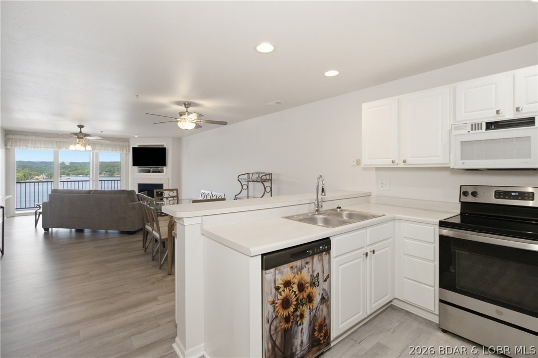 Enjoy the Lake of the Ozarks lifestyle in this beautifully updated 2-bed, 2-bath condo featuring stunning lake views & a 12x32 boat slip with Lift. Located on the 8MM of the Big Niangua, this condo offers the perfect combination of relaxation, recreation, and investment potential with nightly rentals allowed. Inside, you'll find new luxury vinyl plank flooring and a bright, inviting layout designed for easy lake living. Start your mornings on the screened-in porch overlooking the water and spend your afternoons boating, fishing, or exploring everything the lake has to offer. The community amenities are equally impressive, featuring two swimming pools, a pavilion for gatherings, playground, firepit, and a dog park. Golf enthusiasts will appreciate the convenient location near Old Kinderhook Golf and Lake Valley as well as additional dining, entertainment, and recreation opportunities nearby both by land and water. Whether you're searching for a full-time residence, weekend getaway, or an investment property, this lakeview condo checks all the boxes. Schedule your private showing today and start making memories at the lake!