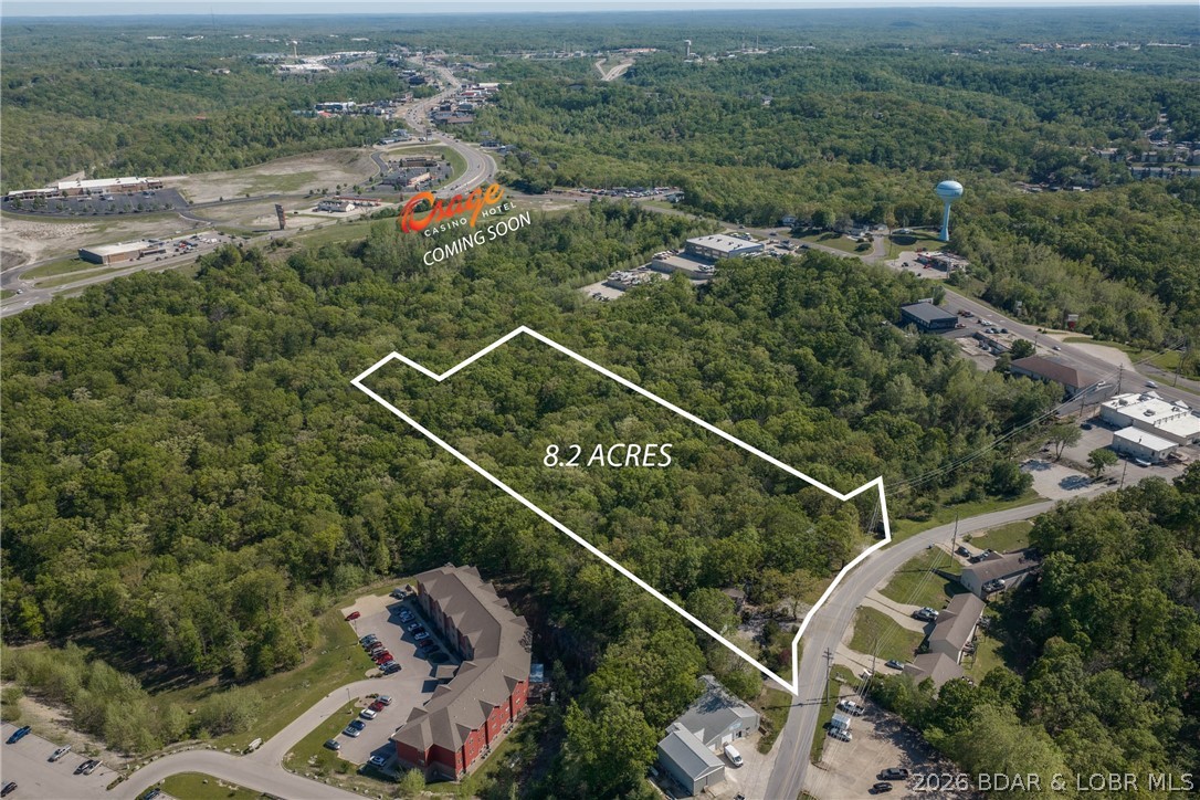 Prime Lake Ozark Development Opportunity Positioned in the heart of one of the fastest-growing areas at the Lake, this 8.26-acre tract sits directly adjacent to the proposed Osage Nation Casino Development—making this a true “buy ahead of the growth” opportunity. Surrounded by established multifamily, commercial developments, & major retail, the location is hard to beat with immediate access to Bagnell Dam Blvd, Hwy 54, and Osage Beach Parkway. The property offers outstanding potential for apartments, townhomes, or mixed-use development, with strong demand for housing already in place. City water/sewer are available, significantly reducing development hurdles. Currently zoned R1 with a clear path to higher density (R3) and potential commercial (C1) use. Existing improvements include a 3 bed, 3 bath home plus 2 additional residences and a detached garage—ideal for rental income while planning your project. Walkable to major attractions, dining, shopping, entertainment, and just minutes from the Bagnell Dam Strip. Large, well-located parcels like this are becoming scarce. If you’ve been waiting for the right development play at Lake of the Ozarks—this is it.