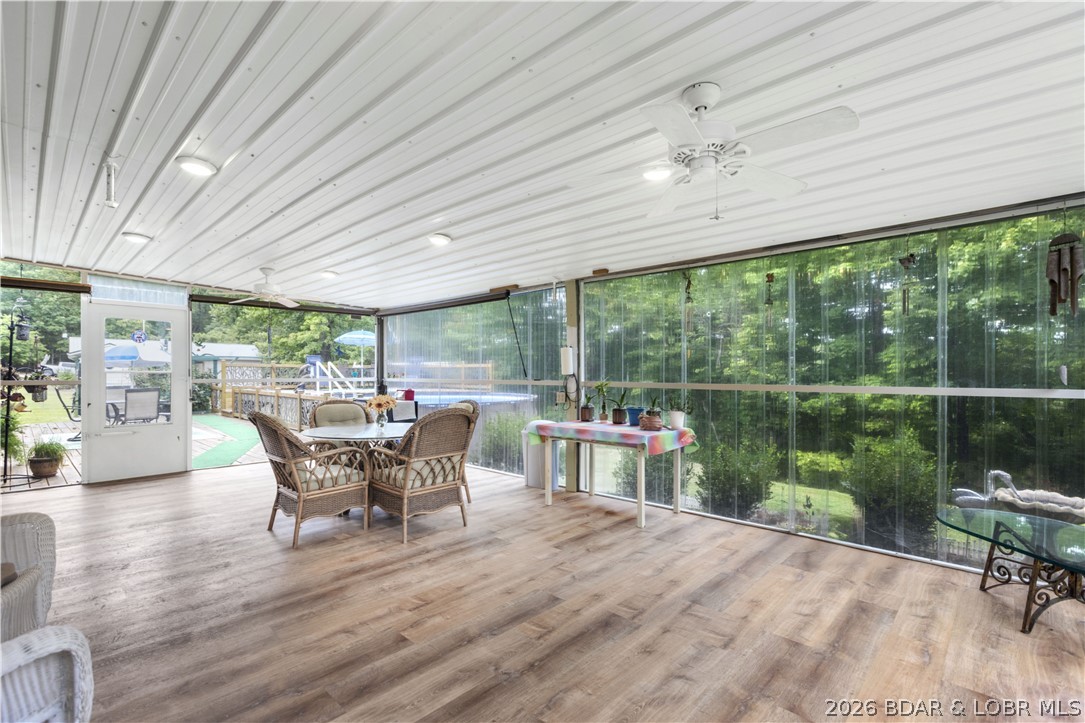 411 Valley Spring Rd in Camdenton offers a relaxed lake-area lifestyle with space to spread out and room to enjoy. Set on approximately 2.25 acres, this 3-bedroom, 2-bath home features comfortable main-level living, a welcoming living area, and a functional kitchen designed for everyday ease. The large screened-in deck overlooks the backyard, while the open deck creates a great entertainment area perfect for gatherings, outdoor dining, and future possibilities like adding a pool or trampoline.

A standout feature is the detached garage with shop space and an apartment, ideal for guests, extended family, hobbies, or rental income. An RV hookup adds even more flexibility for travelers or visiting guests. With ample parking, a carport, and a private setting surrounded by mature trees, this property offers both privacy and functionality. Conveniently located just minutes from Lake of the Ozarks marinas, dining, and local attractions, this property delivers comfort, versatility, and the opportunity to enjoy Missouri living.
