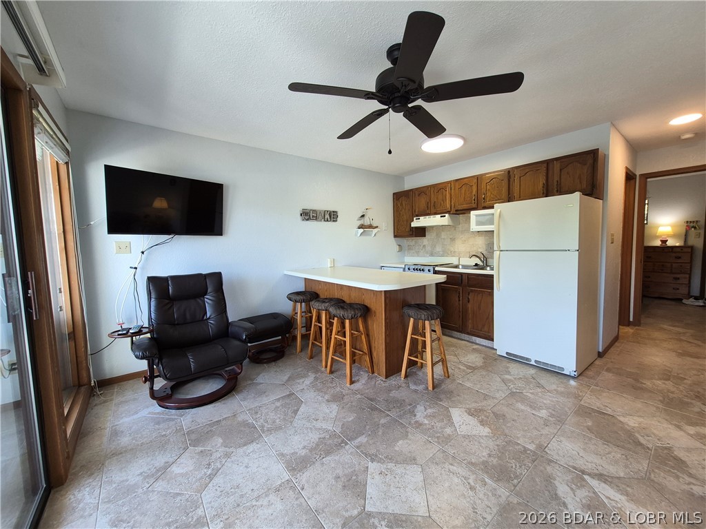Affordable lake living starts here! This NEVER before rented, single-owner 1 bed, 1 bath condo puts you right in the heart of Osage Beach @ the iconic 21 MM—offering unbeatable access to lake life w/o the high price tag. Whether by boat or land, you’re minutes from the action while still enjoying a more peaceful, park like, low-traffic setting. Step inside to a move-in ready space featuring updated tile flooring & backsplash in the fully equipped kitchen, complete w/ built-in microwave & full-size peninsula—perfect for easy living or weekend getaways. Located just one level up from parking, this unit offers main channel views w/ added privacy. This TURNKEY opportunity includes a boat slip, making it easy to hit the water at a moment’s notice. Launch your boat, park your trailer in designated parking & you’re set. Spend your days exploring nearby favorites like Red Head Yacht Club, Dog Days, and Backwater Jack’s or enjoy the amenities w/ poolside relaxation & game of pickleball/tennis. Whether you’re looking for an affordable personal retreat or an income-producing rental, this rare find checks all the boxes. Don’t miss your chance to own a slice of lake life at Heron Bay Unit H302!