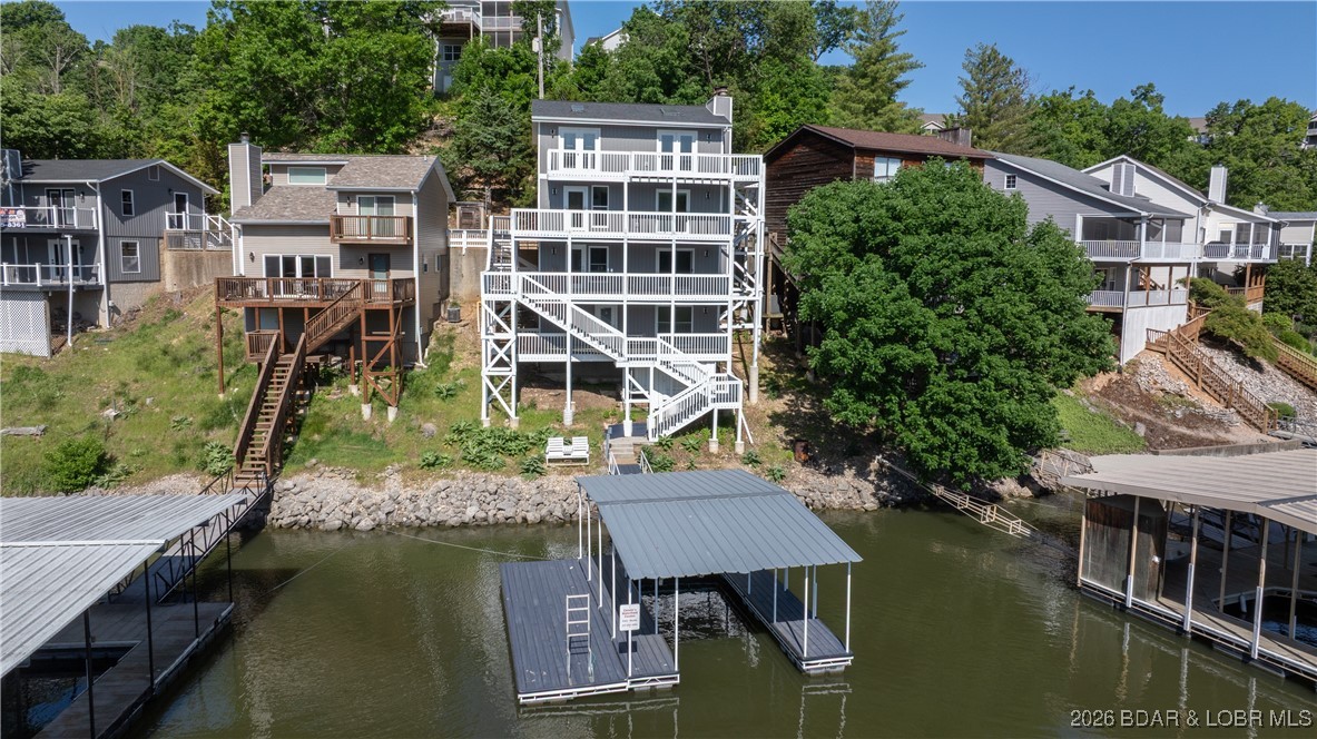 Check out this incredible investment opportunity to own a versatile 4-unit property located right on the water. Whether you're looking to operate a multi-family rental, a spacious single-family home, or live in one unit while renting out the others, this property offers endless possibilities. Enjoy stunning views of the main channel from every level. Completely updated in 2025, the property features luxury vinyl plank flooring, granite countertops, new appliances, siding, roof & more. Each of the 4 units has a private entrance & deck. Unit #1, located on the lowest level, is a studio apartment with a full kitchen & bathroom. Unit #2 includes 1 bedroom, 1.5 bathrooms, a full kitchen, & a living area. Unit #3 also features 1 bedroom, 1.5 bathrooms, a full kitchen, & a living room. Unit #4, situated on the top floor, offers 2 bedrooms, 1.5 bathrooms, a kitchen, & a living area. A shared common area includes a laundry room & interior staircase connecting units. There is plenty of parking with 3 spots directly in front of the house and an additional 4 Parking spots located just above the house on Ginger Rd. The Seller is Motivated! Bring Offers!
