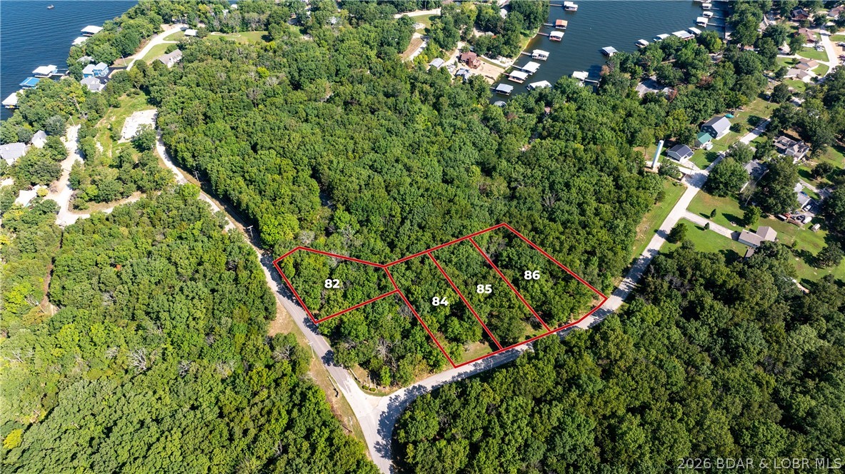 This is a rare opportunity to own four beautiful lots totaling 1.3 acres in the sought-after Sunset Shores subdivision of Climax Springs. Located in a well-established neighborhood, this property offers access to community water and high-speed internet through COMO Direct Fiber Optic, ensuring modern conveniences. For those seeking versatility, the HOA permits the construction of a custom shouse, provided it includes at least 1,200 square feet of living space. This allows homeowners to create their dream home while incorporating a workshop, man cave, or additional functional areas. Whether you're looking for a permanent residence or a peaceful retreat, Sunset Shores offers an ideal environment surrounded by tranquility. With ample space to build, these lots provide a great foundation for your future home or shouse. And as always, the sunset is even more breathtaking when experienced from the comfort of Sunset Shores.