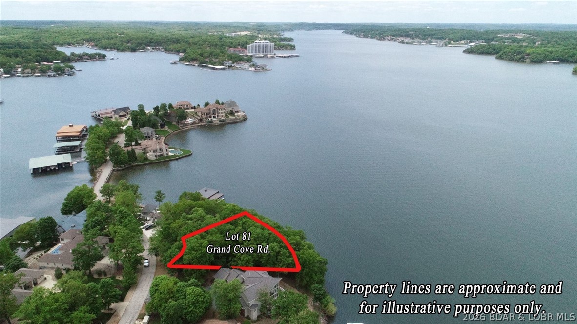 Discover the perfect setting for your dream lakefront estate in the exclusive Porto Cima community at the Lake of the Ozarks. Offering 152 feet of waterfront & gentler topography than many lakefront lots, this exceptional property provides an ideal building site with an easy transition from the road to the water’s edge. What truly sets this property apart is the rare opportunity to purchase the adjoining lakefront lot (MLS #3588448), creating an incredible combined 271 feet of prime shoreline.  Positioned to capture stunning north & west-facing main channel views, you'll enjoy unforgettable sunsets year-round along with seasonal fireworks displays lighting up the lake. This premier homesite is located within one of the Lake’s most prestigious golf communities, home to the renowned Jack Nicklaus Signature Golf Course at Porto Cima. As you explore the property, you'll appreciate the unique combination of buildability, breathtaking views, and exceptional lakefront setting that make this lot truly stand apart. Towering trees, expansive water views, and a homesite create the perfect canvas for a custom luxury residence designed to maximize both privacy & the beauty of the Lake.