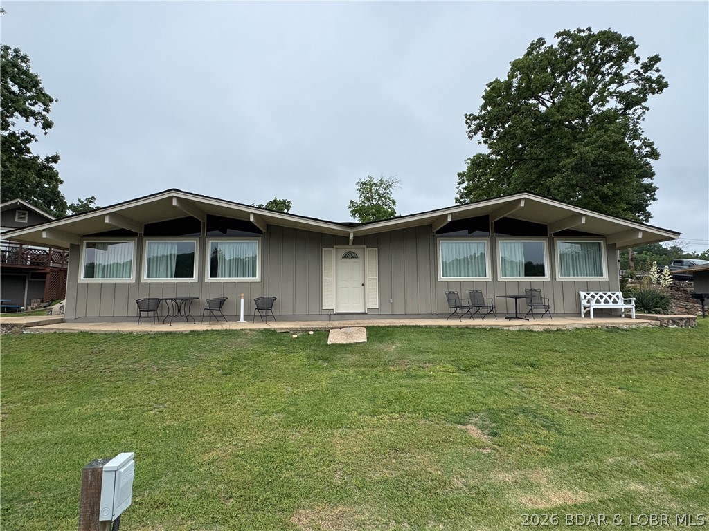 Rare waterfront INVESTMENT OPPORTUNITY with proven vacation rental income potential! This fully furnished duplex includes TWO separate 2-bedroom cabins, offering flexible rental options or the ability to create one larger lakeside retreat. Located in a beautifully restored resort community, the property features vaulted ceilings, tile flooring, covered and open patios, a level walkout to the water, and a 12x32 boat slip in a protected cove off the Osage Arm.
Guests love the vintage resort-style amenities including two outdoor pools, indoor pool, kiddie pool, boat ramp, trailer storage, clubhouse, game room, laundry facilities, covered fishing dock, playgrounds, tennis courts, and basketball courts. Optional on-site management makes this a turnkey investment just minutes from popular lake attractions, dining, and entertainment. A rare chance to own waterfront property with strong rental appeal and exceptional amenities! Check out:https://www.basspoint.com/Accommodations/