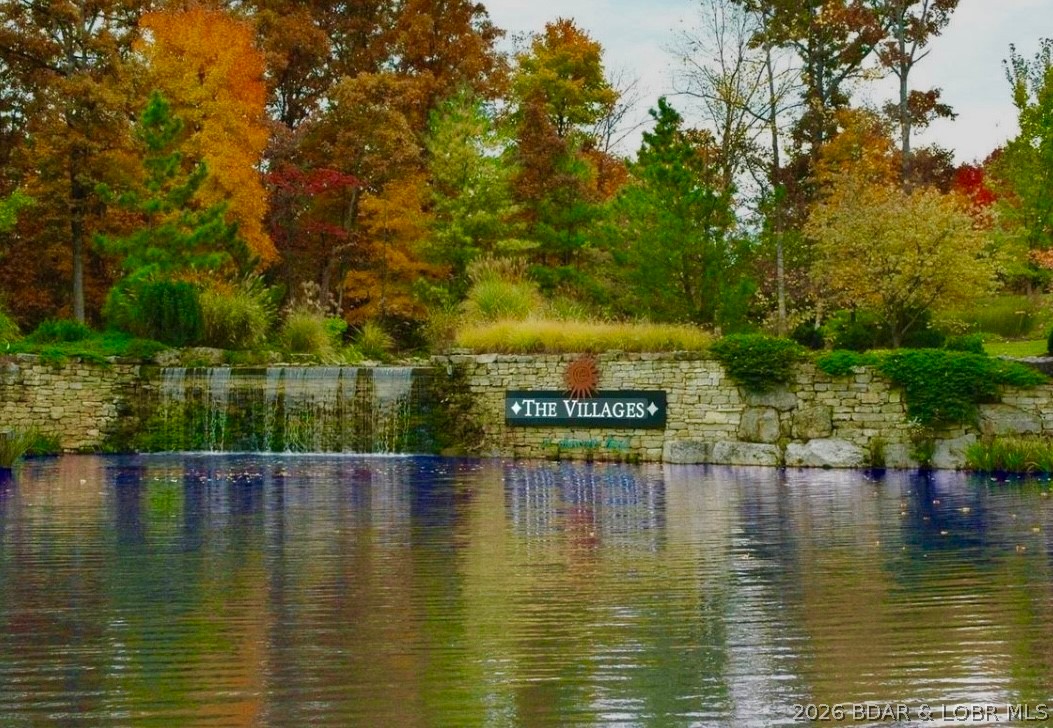 Build your dream home in the highly sought-after...The Villages at Shawnee Bend! This exceptional 2nd tier lot offers beautiful lake views without the lakefront price tag. Perfectly positioned in a well-established, upscale neighborhood, you’ll love the peaceful setting, paved roads, and convenient location by both land and water. Enjoy the best of lake living with close waterfront dining, golf, and entertainment. Whether you're ready to build now or planning for the future, this lot is an incredible opportunity to create your custom lake retreat in one of the area's most desirable developments. Lake Access available via community boat ramp PLUS a new marina is being built.... perfect place to lease a slip! Water and Sewer District is available for Hook Up! Adjoining lot available for extra!
