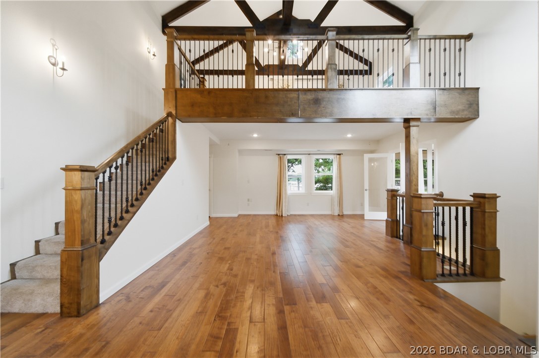 Tucked away in a peaceful cove in Sunrise Beach, this beautifully remodeled lakefront home offers the total package—quality, character, and location. With 100’ of shoreline, a concrete dock with 10x28 slip, and calm water ideal for swimming, kayaking, and relaxing, this is the kind of property people look for. Completely rebuilt down to the studs in 2013, the home was thoughtfully updated with engineered hardwood flooring, custom cabinetry, quartz tops, stainless appliances, spray foam insulation, updated plumbing, electrical, roof, & more. The open living area is loaded with character featuring open ceilings, exposed beams, loft area, & stunning maple and wrought iron stair railings. The spacious sunroom off the living room provides additional lakeside living space and great light. Main level master suite includes heated bathroom floors & a walk-in tiled shower. Located on a county maintained road with easy access, this property offers convenience by both land/water. New asphalt driveway installed in 2026. As added bonus, adjacent lakefront lot with an additional dock is also available, along with adjoining 11.4 acres with blacktop frontage on 3 sides, available for extra money.