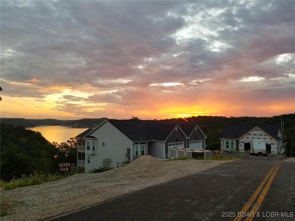 Not yet built villa on premium lake view lot and ready for your customization! Welcome to The Enclaves at Grandview, the newest villas with the best lake views, floor plans and neighborhood on Horseshoe Bend. Main Level Living with 4 Bedrooms and 4 baths, vaulted ceilings, fireplace, 2 lakeside covered decks and a 2 car garage. Upgrades include granite counter tops, stainless steel appliances, luxury vinyl flooring, walk-in onyx master shower and more. Additional option included is lower level wet bar w/ fridge & microwave. Can be eliminated prior to construction to lower purchase price. Options & floor plans attached. Pick your finishes and customize! Enclaves/Grandview Community amenities include lake access, club house, pool, playground, community docks with golf cart path to docks. Low assessments. Boat slips available for extra $. Close to town & so convenient to grocery stores, shopping, restaurants, hospital & much more! Come see today!