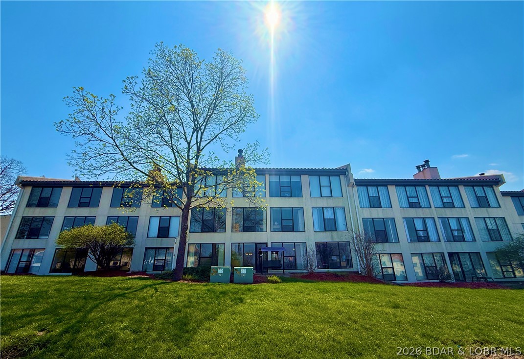 Wake up to shimmering LAKE VIEWS and sunlight pouring through stunning floor-to-ceiling windows in the expansive living room, master suite and second bedroom. This beautifully designed condo offers an OPEN LAYOUT perfect for hosting friends at the breakfast bar while drinks flow from the wet bar, and laughter carries into the evening.
The spacious master retreat features a spa-like his-and-hers bathroom with a JETTED TUB, creating the perfect place to unwind after a long day on the lake. Outside, enjoy your private 10x24 BOAT SLIP with a large storage locker, which is water/electric safe and secured in a gated marina, ideal for early morning fishing trips or sunset cruises.
Rain or shine, relax with access to both INDOOR & OUTDOOR POOLS, also enjoy the convenience of covered, assigned parking and a large laundry room that makes everyday living effortless. Whether you’re seeking a weekend escape or a full-time lakeside lifestyle, this condo is built for making memorie.. morning coffee with a view, afternoons on the water, & evenings filled with comfort and relaxation. Come see this property for yourself! BONUS: Boat lift has been recently rebuilt to last at least another 25 years!