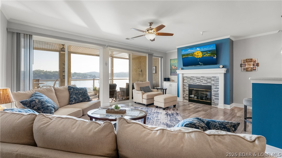 Great value! Experience lakeside living at its absolute finest in this stunning, turn-key walk-in condo at West Palms on the Lake. Offering a true single-family home feel.Beautifully updated residence features fresh paint, new modern fixtures, crown molding & soaring 9-foot ceilings. The bright open-concept floor plan showcases a spacious living area, cozy fireplace, new entertainment wall. Oversized sliding glass doors ensuring unobstructed panoramic main channel lake views.The modern kitchen boasts solid surface countertops, SS appliances + generous dining area ideal for hosting. 3 spacious private ensuite bedrooms+ stylish 1/2 bath. Step outside to your private oasis:an expansive 13'x 38' concrete patio featuring sleek glass railings that ties directly into a screened-in deck-the ultimate layout for effortless indoor-outdoor entertainment, plus storage closet.Complete with a dedicated laundry room, elevator access, assigned parking, and overflow parking. Resort-style community amenities include a lakefront pool, clubhouse with a fitness center, boat trailer parking, 12x32 slip in community dock.Just minutes from the area’s most popular waterfront dining and town hot spots!