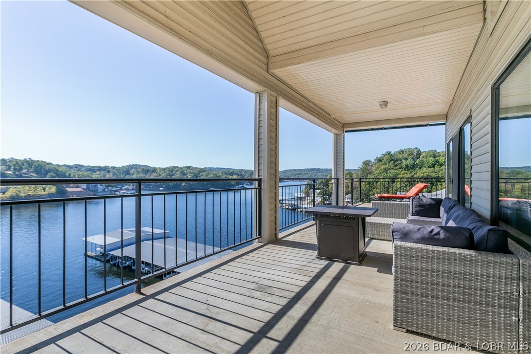 Experience lake life at its finest in this spacious 3-bedroom, 3.5-bath, two-level penthouse condo offering nearly 2,500 sq. ft. and breathtaking panoramic views of MM2 at Lake of the Ozarks.
Take in the scenery from the extra-large covered deck—perfect for entertaining or simply relaxing. Inside, the open floor plan, soaring ceilings, and abundant windows create a bright and inviting atmosphere filled with natural light.
Main Features:
• Split-bedroom design with two en-suites (one on each level)
• Walk-in closets and walk-in shower
• Wet bar for easy entertaining
• Turn-key and ready to enjoy
• Nightly rentals allowed
Enjoy fantastic community amenities, including two swimming pools, tennis court, playground, and clubhouse
This condo offers the perfect blend of space, comfort, and location—close to all the fun by land and water. Don’t miss your opportunity to own one of the most desirable lakefront properties at The Falls. A perfect place to put your personal stamp on it!
Waterfront Features:
True lakefront with stunning main channel views, easy water access, and ideal positioning for enjoying everything lake living has to offer.
