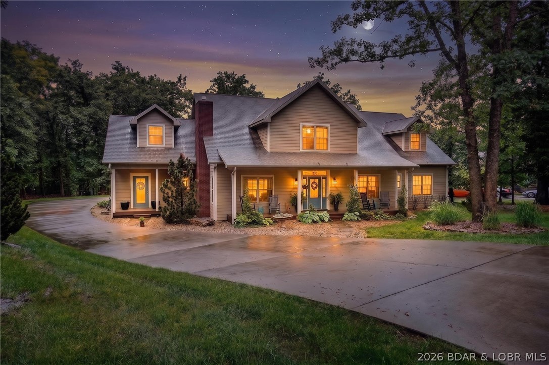Set on a beautifully landscaped, nearly one-acre lot in The Villages at Shawnee Bend, this 5-bed, 6-bath home blends a warm Southern Living aesthetic with everyday ease. Built by one of the lake's most respected builders, it offers true single-floor living — including the primary suite, a private office, and main-level guest rooms — plus generous space upstairs for family and visitors.
The heart of the home is its indoor-outdoor flow: a screened porch opening to a stunning flagstone courtyard wrapped in woods, two gas fireplaces, ¾" ebony hardwood throughout, and a chef's kitchen made for entertaining. With boat slip availability nearby, lake life is always within reach.
Just a golf cart ride away, the brand-new Harbor 19 Marina is being reimagined with luxury slips, gas dock, an upscale ship store, and with more amenities on the way. A premier boating destination right in the neighborhood.
Schedule your showing today — a home big enough for everyone in a neighborhood that will never go out of style.