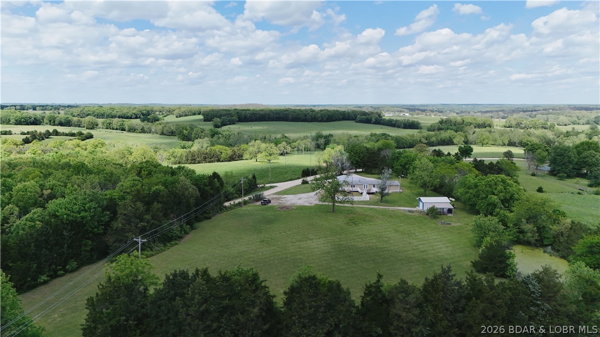 Spacious home on 5.9 acres just north of Eldon, MO! Welcome to 224 Starling Rd in Olean—offering an open floor plan designed for comfortable living and entertaining. The kitchen features custom cabinetry, granite countertops, gas stove, and a large pantry, flowing into a warm living area with a fireplace. This home includes 2 master suites, 2 additional bedrooms, and 2.5 baths with walk-in showers—ideal for multi-generational living or flexible use with a second living space option.

Enjoy the outdoors with a large open field, shop with 2 animal stalls, attached 2-car garage, fenced backyard with dog house, storage shed, and both covered front porch and back deck. Fully remodeled in 2019 with a substantial addition.

Property includes 4.1 acres with the home plus an additional 1.8-acre tract across the road. Conveniently located between Jefferson City and Lake of the Ozarks in the Eldon School District, with easy access to employment, shopping, and recreation.