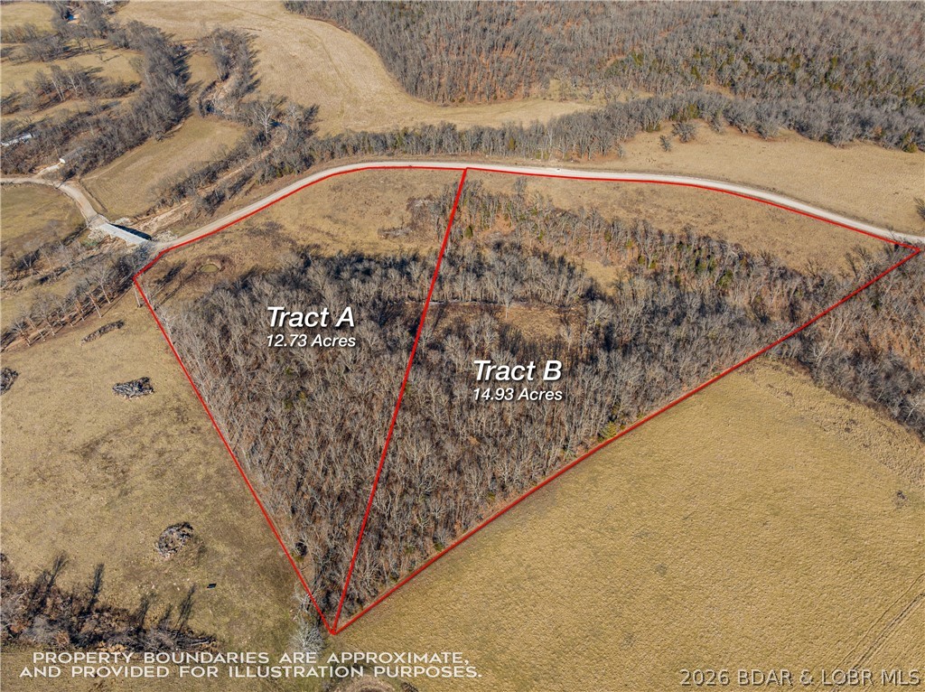 12.73 acres located in Camden County. Just 15 minutes to Camdenton. This tract is perimeter fenced (except along the shared boundary with Tract B) and features gated entry. The property offers a balanced mix of open pasture and pockets of timber, along with a pond. Surrounded by established grazing ground, this acreage is well-suited for livestock, recreation, or a private homesite in a strong rural corridor. Additional acreage available — this tract is part of a larger 27-acre offering (MLS 3584128) and can be purchased together for expanded flexibility and connected use.
