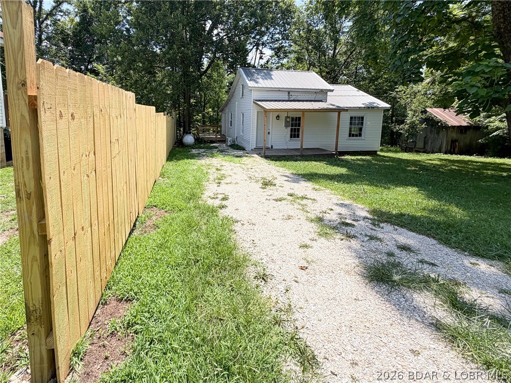 This charming updated 1940s bungalow now offers even more value than ever. Since the home was first listed, the seller has invested more than $5,000 in additional improvements with no increase in the asking price. Two new windows, recently installed along with energy-efficient mini-split systems providing year-round heating and cooling. Beautifully crafted privacy fence complements the new deck, creating an inviting outdoor space for relaxing or entertaining. The fenced garden area & historic shed add even more versatility for gardening, hobbies, or extra storage space. This home offers one level living space and is move in ready! Previous improvements include a new metal roof, refreshed front porch, new water heater, updated front and rear siding, updated lighting fixtures, ceiling fan, and added insulation. Enjoy the charm of historic Iberia with convenient access to Lake of the Ozarks, Bennett Springs, fishing, and outdoor recreation. Whether you’re searching for a full-time residence, weekend getaway, or investment opportunity. This home offers outstanding value, modern comfort, and small-town charm.