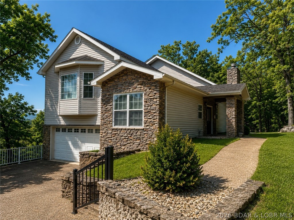 6835 Saint Tropez Circle in Osage Beach offers inviting Lake of the Ozarks living with beautiful views, generous space, and a 10x30 boat slip on the community dock. Lovingly maintained by the original owner, this 4-bedroom, 2.5-bath home features 3,134 sq ft, a multi-level layout, walkout lower level, wood-burning fireplace, and attached 2-car garage. Spend mornings on the covered, screened deck, then step onto the open deck for grilling and sunset dinners. The community pool is just above the dock, making it easy to move from poolside relaxation to an afternoon on the water.