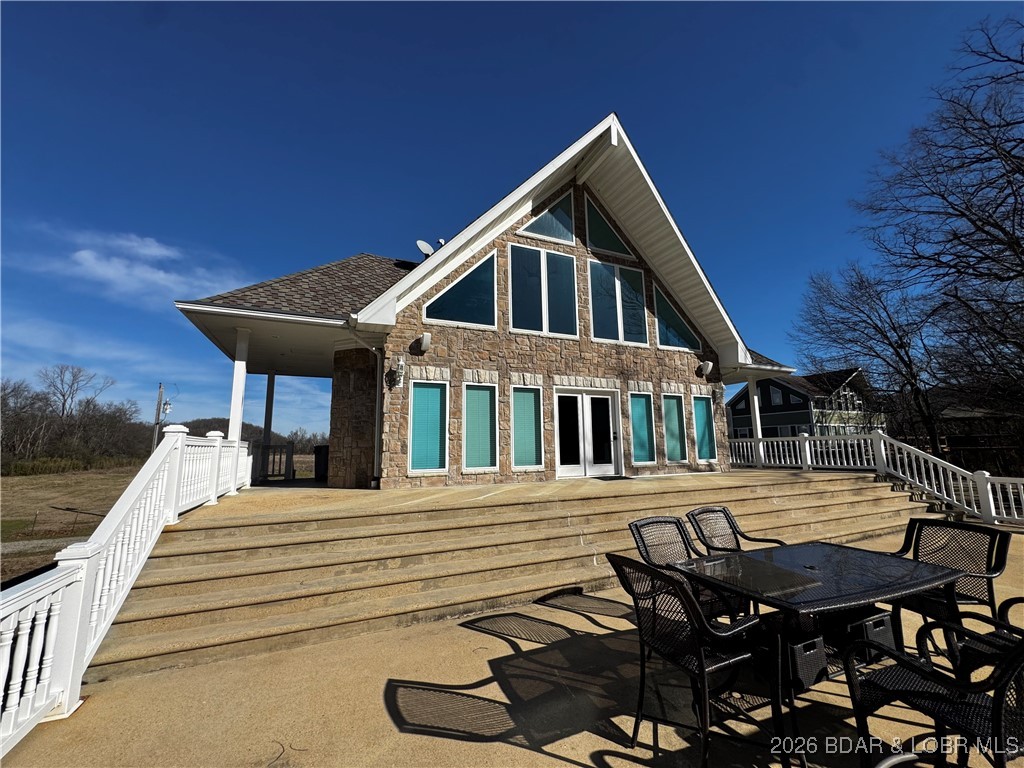 Waterfront stone home on the Current River in Doniphan, Missouri! This charming 3-bedroom, 1-bath property offers stunning views up and down the river and is the perfect retreat or investment opportunity. Built entirely of stone, the home features rustic character with modern comfort and comes fully furnished, making it truly move-in ready. Inside, you’ll find a spacious bathroom with a large soaking tub, ideal for relaxing after a day on the water. Step outside to the huge riverfront deck, perfect for entertaining, grilling, gathering around a fire pit, or simply enjoying the peaceful scenery. Whether you’re looking for a full-time residence, weekend getaway, or vacation rental, this rare waterfront property delivers unbeatable views, privacy, and charm.