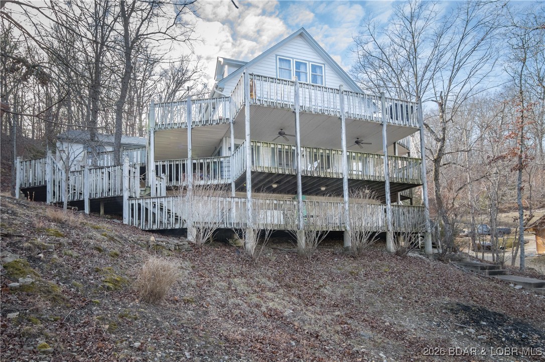 **HUGE PRICE REDUCTION** 110K Lower **Lakefront on "3" Acres **   **30' X 40' Building with 2 bays** One owner Custom Built Home - 4/3 Lakefront home sits on 80' of Lakefront in a large wide deep water cove. Includes over 3 acres with a **HUGE 30' X 40' SHOP** shop includes extra tall doors for RV parking/storage. Main level living home with a Newly remodeled Kitchen, includes custom cabinets, counter tops, lighting & more! Living room, Primary bedroom, and Full bath! Home includes multiple levels of living space. Lower level walkout includes Rec room, Bar, Bedroom and Bath. Top floor has 2 Bedrooms & a Full bathroom! Detached 2 car garage! Lot's of deck space for outside entertaining and to enjoy the lake. Nice private dock! Cove setting with a lot of privacy. Nightly Rentals ARE Allowed