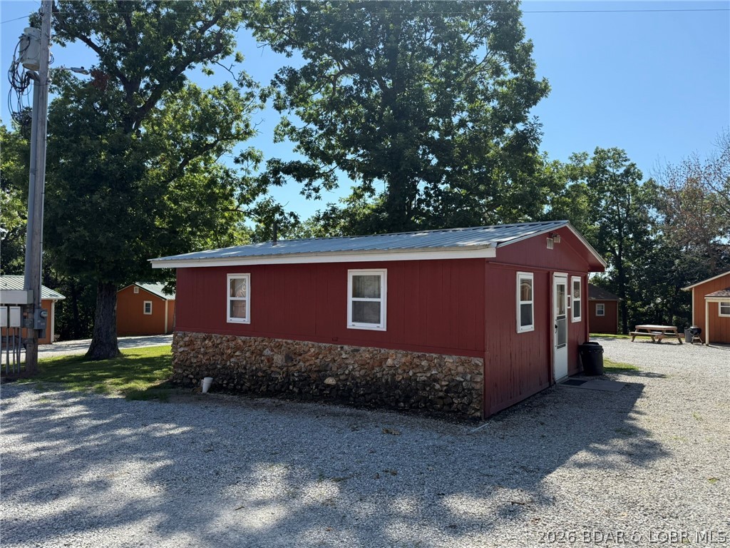 Cabin 6 is a single room with full kitchen, range with oven and refrigerator. Just down the road from Truman State Park Marina giving you quick and easy access to Truman Lake, while also being close to Drake Harbor where you can access the Lake of the Ozarks. This cabin has been a successful rental and has a long client list. Could be utilized as an Airbnb or long-term rental on the side