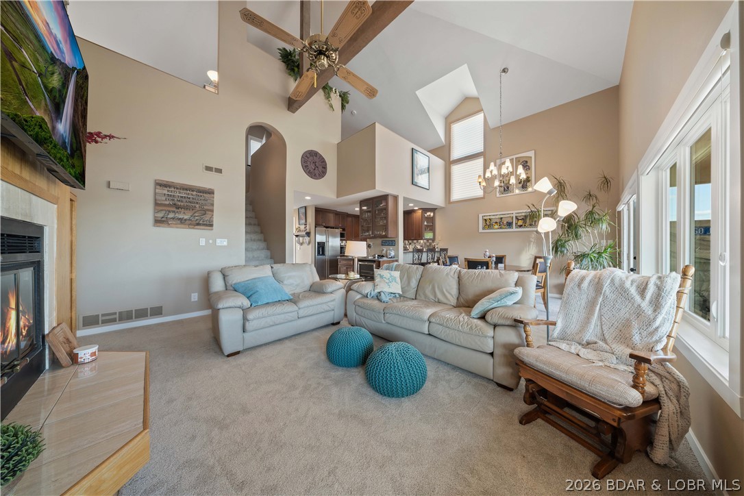 Huge price reduction on one of the best values at the lake! If you've been waiting for the right condo, this top-floor end unit at Emerald Bay deserves a look. Sold turn-key, this spacious 4-bedroom, 3-bath condo offers 2,089 sq ft and is only one level up from parking for easy access. The open floor plan leads to breathtaking main channel views, while the loft with a full bath creates the perfect second living area for guests, kids, or extra sleeping space. The kitchen features Cherry Omega cabinetry, quartz countertops, stainless steel appliances, and a custom bar with a wine fridge and roll-out shelving. You'll also appreciate the separate laundry room and abundant storage throughout. Recent 2026 updates include new carpet, interior doors, trim, can lighting, LVT flooring in closets, deck carpet, and new living room and north windows. The hall and primary baths have been beautifully updated, and the electric water-vapor fireplace adds a modern touch. Includes a 12x42 boat slip with lift plus a 12x24 PWC slip with lifts. Nightly rentals are allowed, making this an incredible full-time home, vacation getaway, or investment opportunity.