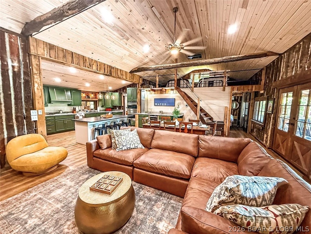 This log cabin dates back to the 1890, is beautiful remodeled and updated with modern conveniences.  Tucked in a protective cove and situated on 1.7 acres with tones of parking, this property is quiet and secluded but also close to many conveniences, 5 mins from Camdenton, on the Big Niangua.  Stunning views exist from inside with huge picture windows, the covered back deck that spans the length of the cabin, the large lakeside fire pit area, and new hot tube.  So much character with an enormous kitchen, giant island hidden bunk room, loft, 3 full baths and four bedrooms.  New HVAC, a wood burning floor to ceiling rock fireplace and tankless water heater make the home comfortable year round.  2 slip dock with lifts, a swim platform and jet ski lift is included.  Currently used as short term rental, this home is an excellent investment property, sleeps 12 comfortably and previously booked multiple times every month last year.  Property has recently been appraised at $755,000.