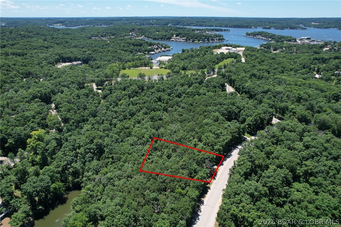 Sweet lot on a great cul-de-sac off Casco Court.  Super gentle topo, situated extremely close to a very large waterfront common ground within the Four Seasons community - toss in a fishing pole or take a swim off the lakeside shore.  Best amenity package at the Lake with numerous close by launch ramps, tennis and pickleball, indoor and outdoor swimming pools, clubhouse, and more.  Great community with numerous planned activities for an inviting population of full time and part time owners.  Close to marinas for boat storage, too.  Take a tour of all the Village of Four Seasons has to offer! Lots of great information at http://FourSeasonsPOA.com.