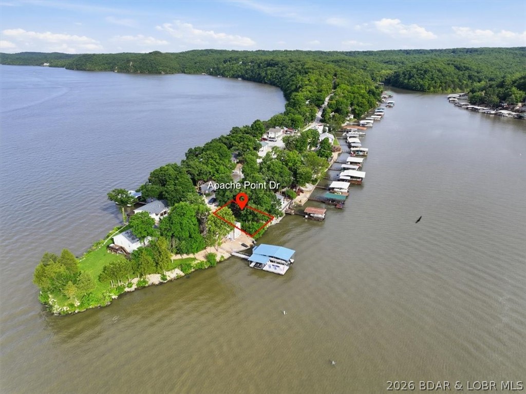 THINK THE VERY GENTLE BUILDABLE LAKE LOTS ALL GONE? NOPE! Own an affordable lakefront lot in Apache Point Subdivision at Lake of the Ozarks. This waterfront parcel offers the chance to build your own lakefront cabin— a place where mornings start with coffee by the water, afternoons are spent out on the boat, and evenings end around a fire with family and friends. Located in Climax Springs just off Hwy 7, down Bollinger Creek Rd. at the mile market close to fun! This property offers a peaceful setting while still being close to all the lake fun, including boating, fishing, waterfront restaurants, and entertainment. Whether you’re looking to build a weekend getaway or a future full-time lake home, this property offers a great opportunity to create your own piece of the Lake of the Ozarks lifestyle. 
To help showcase the waterfront's potential, Atlas Docks has already completed a preliminary dock concept drawing. 
Please see the attached document for possible dock layouts and boat slip sizing options. Properties like this are getting harder to find — especially at this price point. Bring your lake house plans and start imagining the memories waiting to be made here.