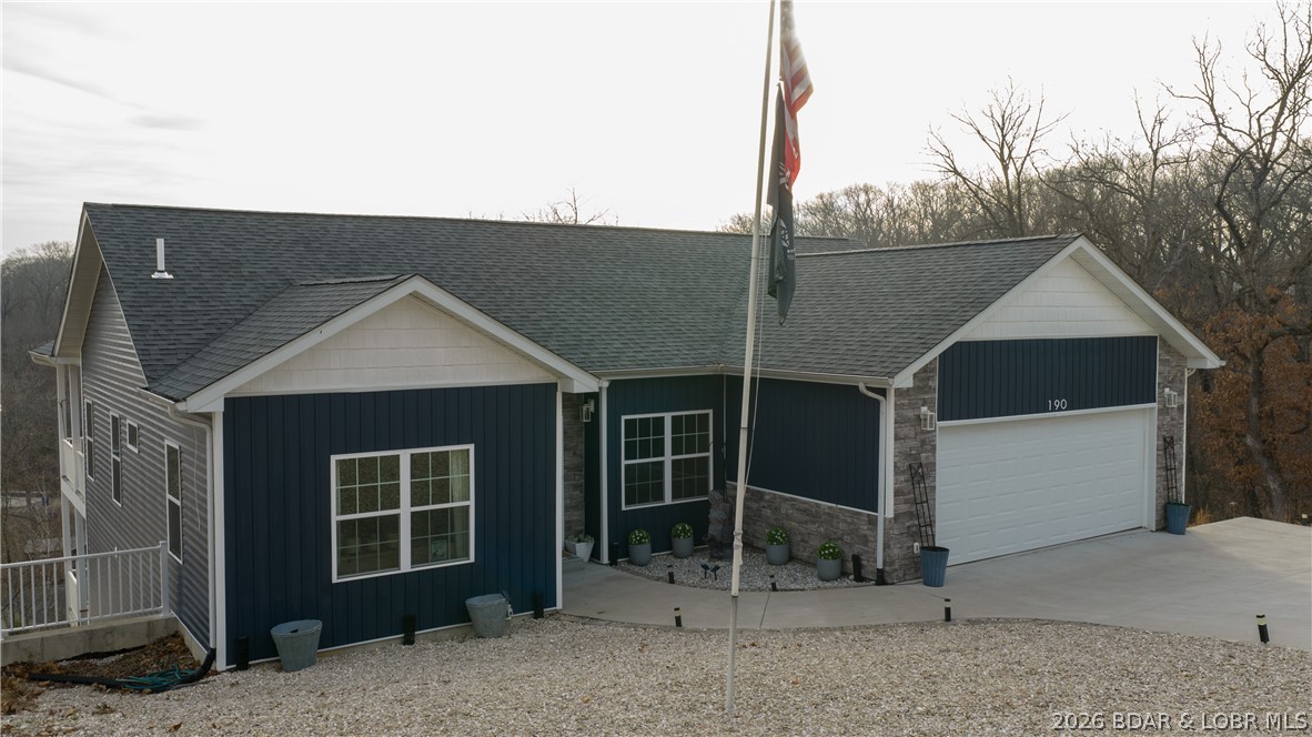 Spacious 5-bedroom, 3-bathroom home is ready for its new family!  Step into a new chapter of your life with this elegant and well appointed home located in a low key residential setting within walking distance to the iconic Bagnell Dam Strip, school and church. Full of natural light from the oversized windows and huge triple sliding door show off a seasonal view of the LAKE. The home flows effortlessly; perfect for family gatherings and holidays. You will be impressed by an impeccable kitchen, it is the centerpiece of the home, beautiful and large enough for several cooks and lots of snackers. You will be proud to show off this house to family and friends. The lower level is ready for action! A supersized family room to spread out, entertain or practice cartwheels, a wet bar and additional 3 bedrooms and full bath. Dining, shopping, live music, and fun lake activities are just minutes away; close enough to enjoy, but far enough to keep the peace at home. CALL YOUR REAL ESTATE PROFESSIONAL TODAY!