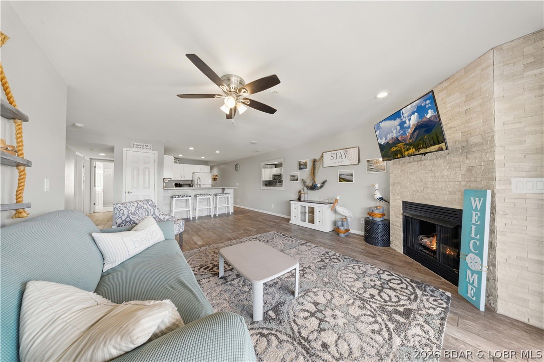 Big lake views, easy lake living, and nightly rentals allowed—this turn-key condo checks all the boxes. Located at Clearwater Condos on the 8.5MM of the Big Niangua in Camdenton, this 3-bedroom, 2-bath condo offers the perfect mix of relaxation, investment potential, and fun at the lake. Inside, the open layout features beautiful tile flooring, a stunning stone fireplace, and kitchen bar seating that’s perfect for gathering with family and friends. The covered shaded deck is the ideal place for morning coffee, afternoon naps, and peaceful lake views. A 12x32 boat slip with lift is included, giving you quick access to some of the best boating on the lake. Clearwater Condos is known for its friendly atmosphere and great amenities including 2 pools with one heated, a community pavilion, playground, firepit, and year-round social events. Dog friendly and conveniently located near golf courses, Ha Ha Tonka State Park, dining, and entertainment, this condo is move-in ready and set up for immediate enjoyment.