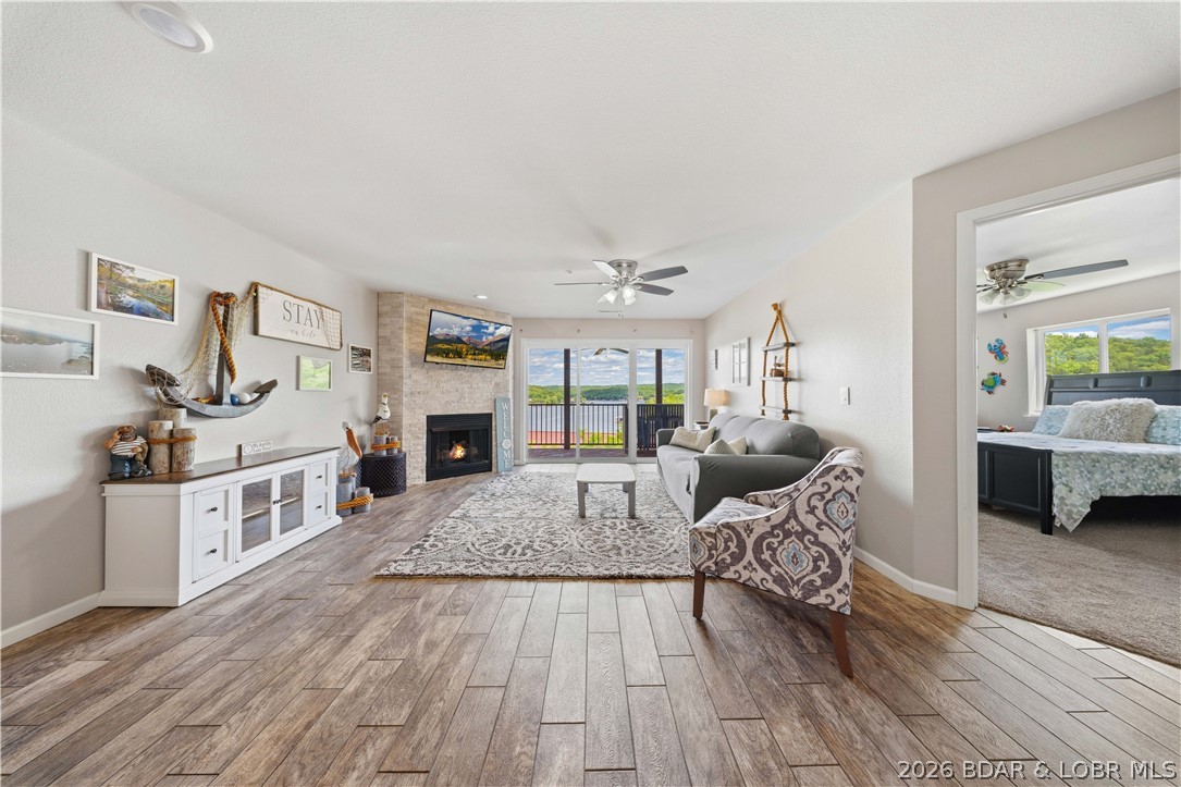Boat included! Start enjoying the lake from day one with a 1999 248BR Crownline (only 450 hours—see photos). Big lake views, easy lake living, and nightly rentals allowed make this turn-key condo an incredible opportunity. Located at Clearwater Condos on the 8.5MM of the Big Niangua in Camdenton, this 3-bedroom, 2-bath condo is perfect as a vacation getaway, investment property, or full-time home. The open floor plan features beautiful tile flooring, a stunning stone fireplace, and a kitchen with bar seating that's ideal for entertaining. Relax on the covered, shaded deck while taking in the peaceful lake views. A 12x32 boat slip with lift is included for quick access to the water. Clearwater offers outstanding amenities including two pools (one heated), a community pavilion, playground, firepit, year-round social events, and is dog friendly. Conveniently located near golf, Ha Ha Tonka State Park, restaurants, and entertainment, this move-in-ready condo is ready for you to enjoy the best of Lake of the Ozarks.