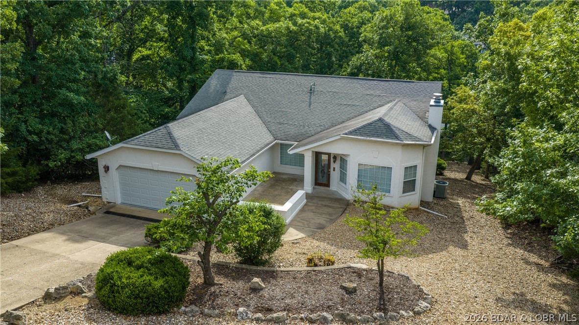 Tucked away in a quiet cove within the Village of Four Seasons/Regency Cove, this spacious 6BR/4.5BA lakefront home offers 3,852 sqft. Designed for entertaining, the home features two large living areas, family room downstairs, vaulted ceilings in main level, hardwood floors, abundant natural light, a relaxing lakeside sunroom, expansive kitchen with pantry & open dining area with access to 1 of 3 decks. The primary suite, along with two lower-level guest suites, offer large private baths, dual vanities, walk-in showers, all also have deck access. Enjoy peaceful lake views from partially covered lower level deck which leads down to the private dock with 10x24 slip with boat lift included. Located close to popular lakefront restaurants & shore restaurants, coffee shops, shopping & entertainment; by both land AND water. Furniture is included with minimal exclusions, making this an excellent full-time residence or vacation home at Lake of the Ozarks. 2 bedrooms downstairs are nonconforming rooms but ideal for bunk rooms, office space or a home gym.