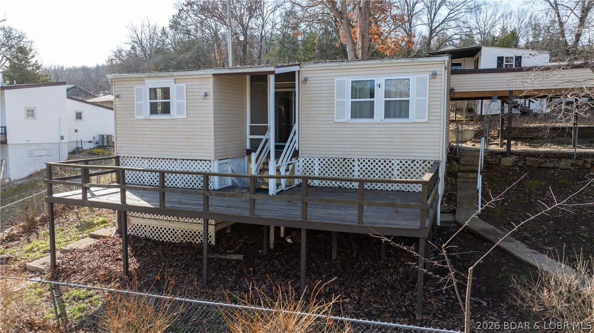 Hard to Find Second Tier Opportunity with Guest Cabin, Income Potential & Incredible Views! Priced to sell, and besides having a house and a guest cabin, there is ample parking (even for your boat trailer), a boat ramp near the homes, fenced in yard and easy water access to the Big Niangua.  Bring your vision and make this charming property your own! Situated on a scenic lot with beautiful lake views, this two-bedroom, one-bath home offers the perfect blend of peaceful waterfront living and investment potential. The main house features a functional layout and has been recently updated.  With a little TLC to the decks, this historic house could become the ideal weekend retreat, full-time residence, or vacation rental.  Adding even more value is the detached one-bedroom, one-bath guest cabin (also recently updated) — perfect for extended family, visitors, or additional rental income. Live in one and rent the other, or maximize your return by renting both.

Enjoy morning coffee overlooking the water, afternoons on the lake, and evenings with stunning sunset views. Properties with lake access, views, and income flexibility at this price point are rare. Come take a look!